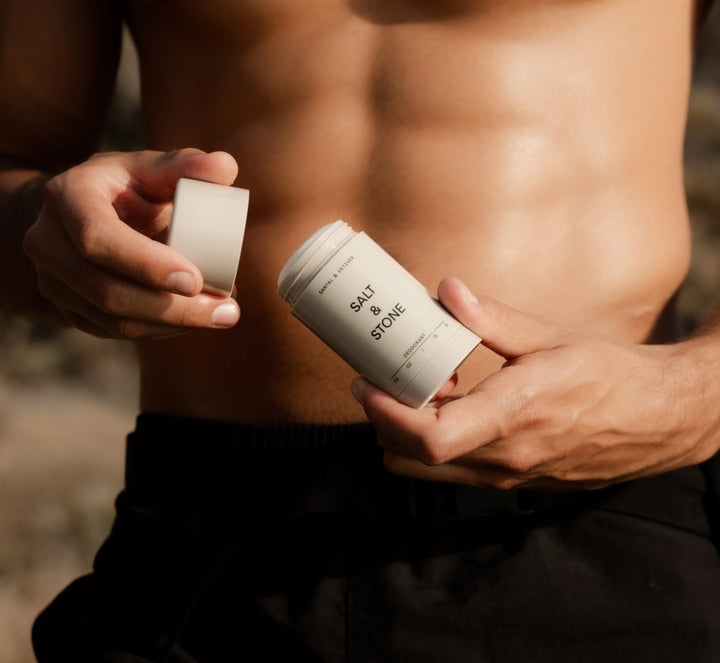 Salt and Stone deodorant held open outdoors